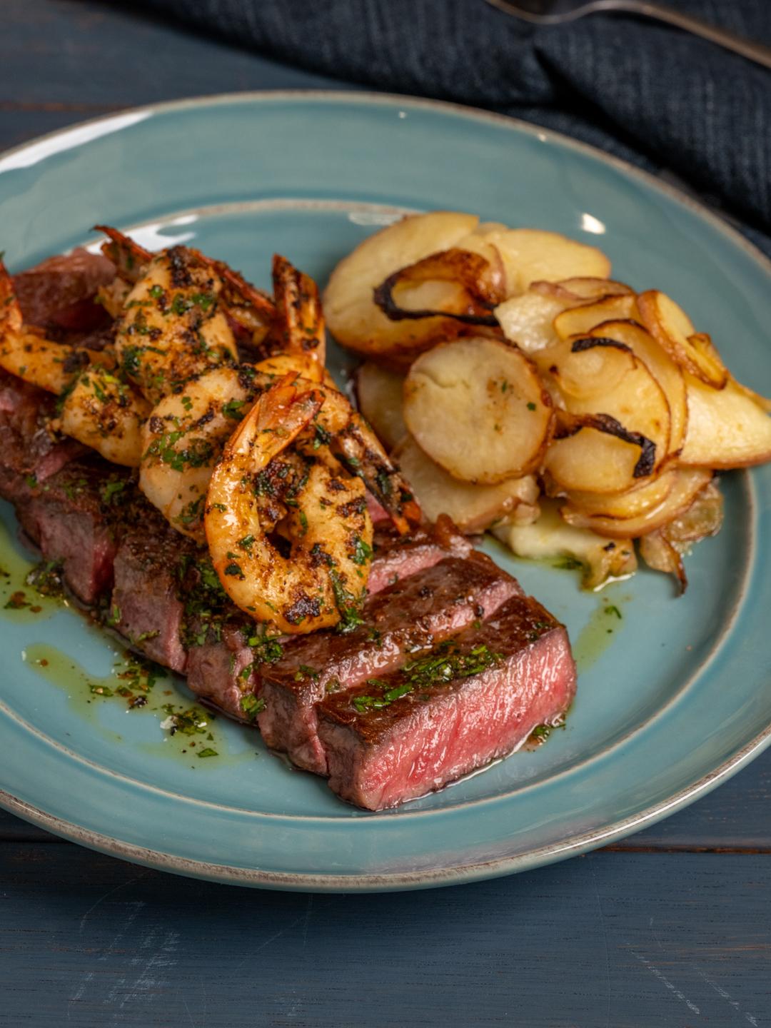 Turbo NY Strip with Shrimp and Potatoes Lyonnaise 