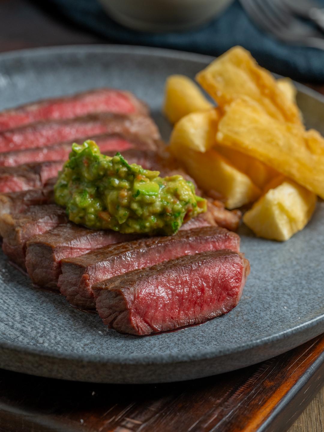 Turbo NY Strip with Guasacaca and Yuca Frita 